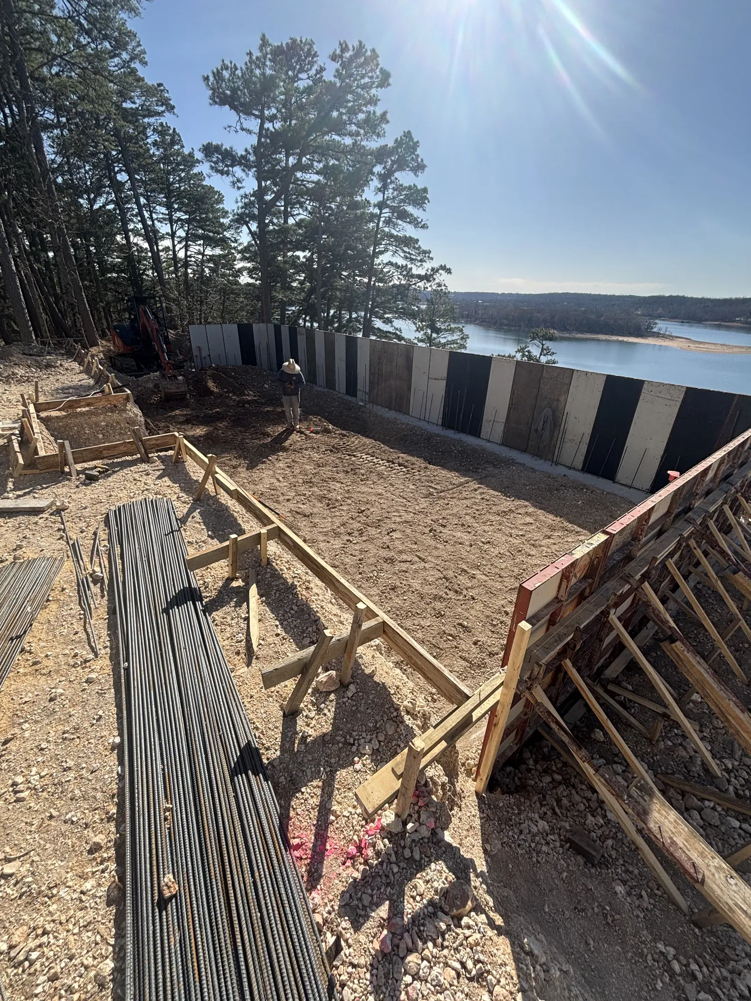 Concrete walls and rebar at lakeside pool build in Northwest Arkansas