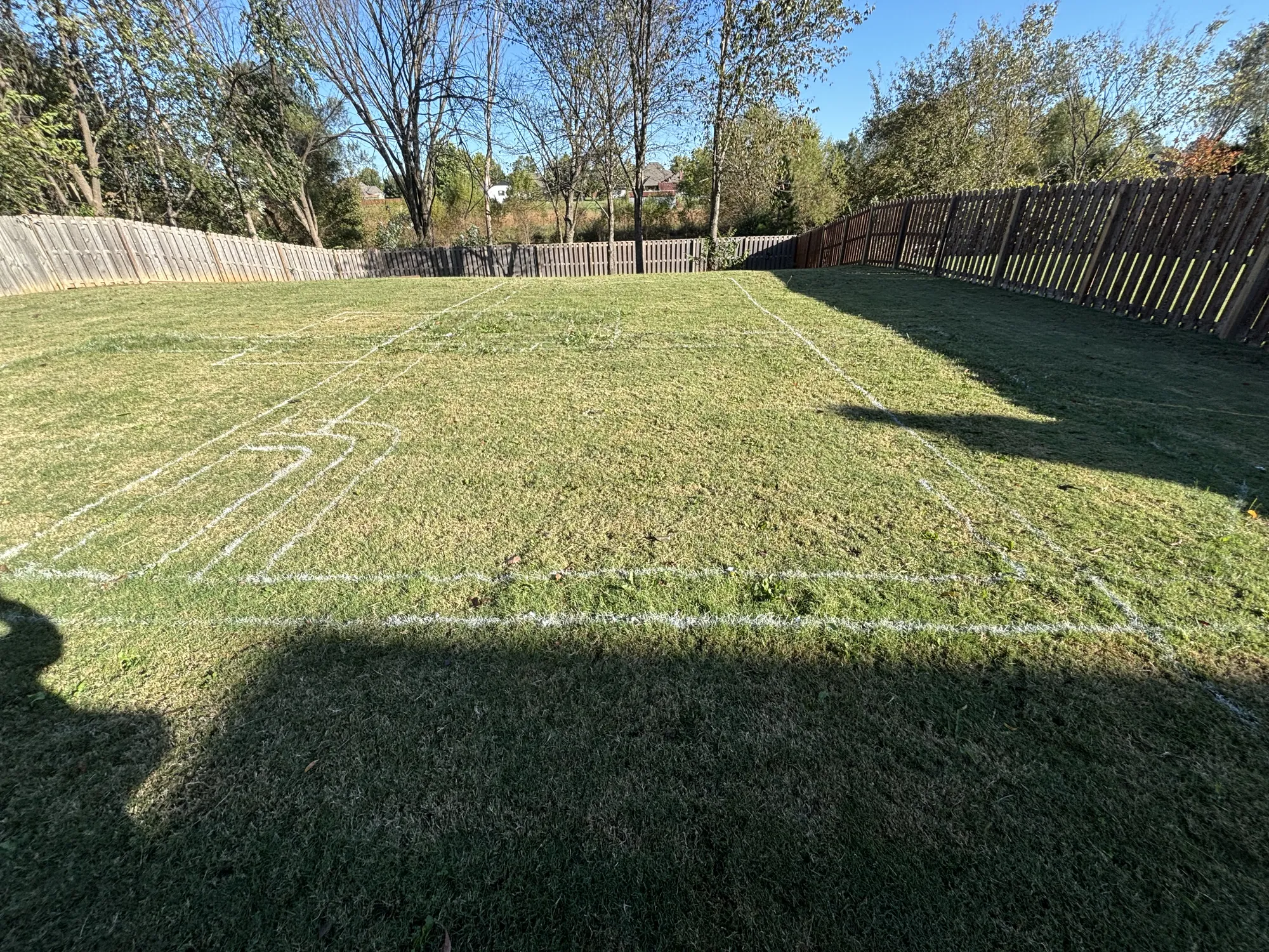 Pool layout marked on grass in Northwest Arkansas