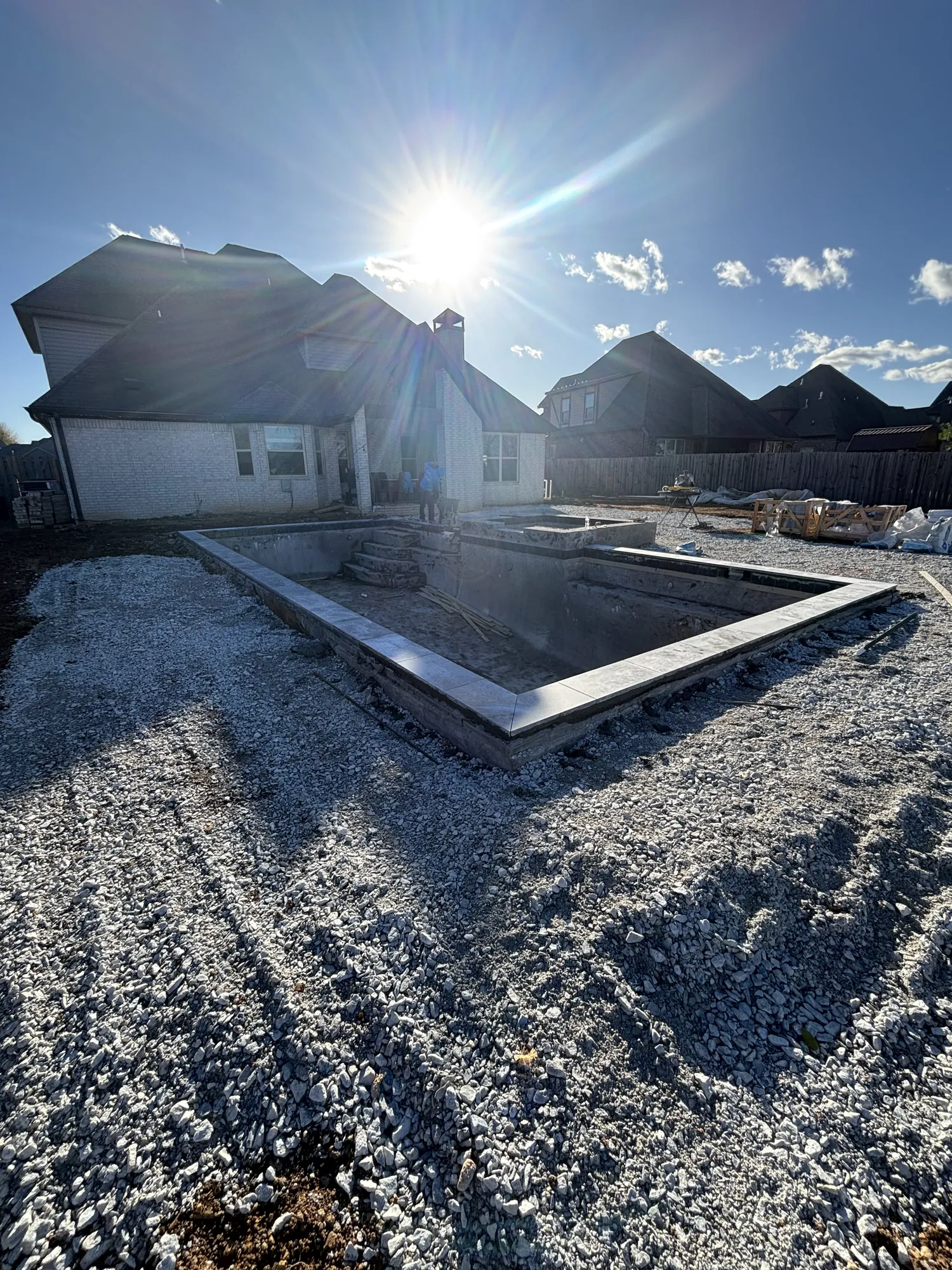 Pool shell with coping installed during construction in Northwest Arkansas