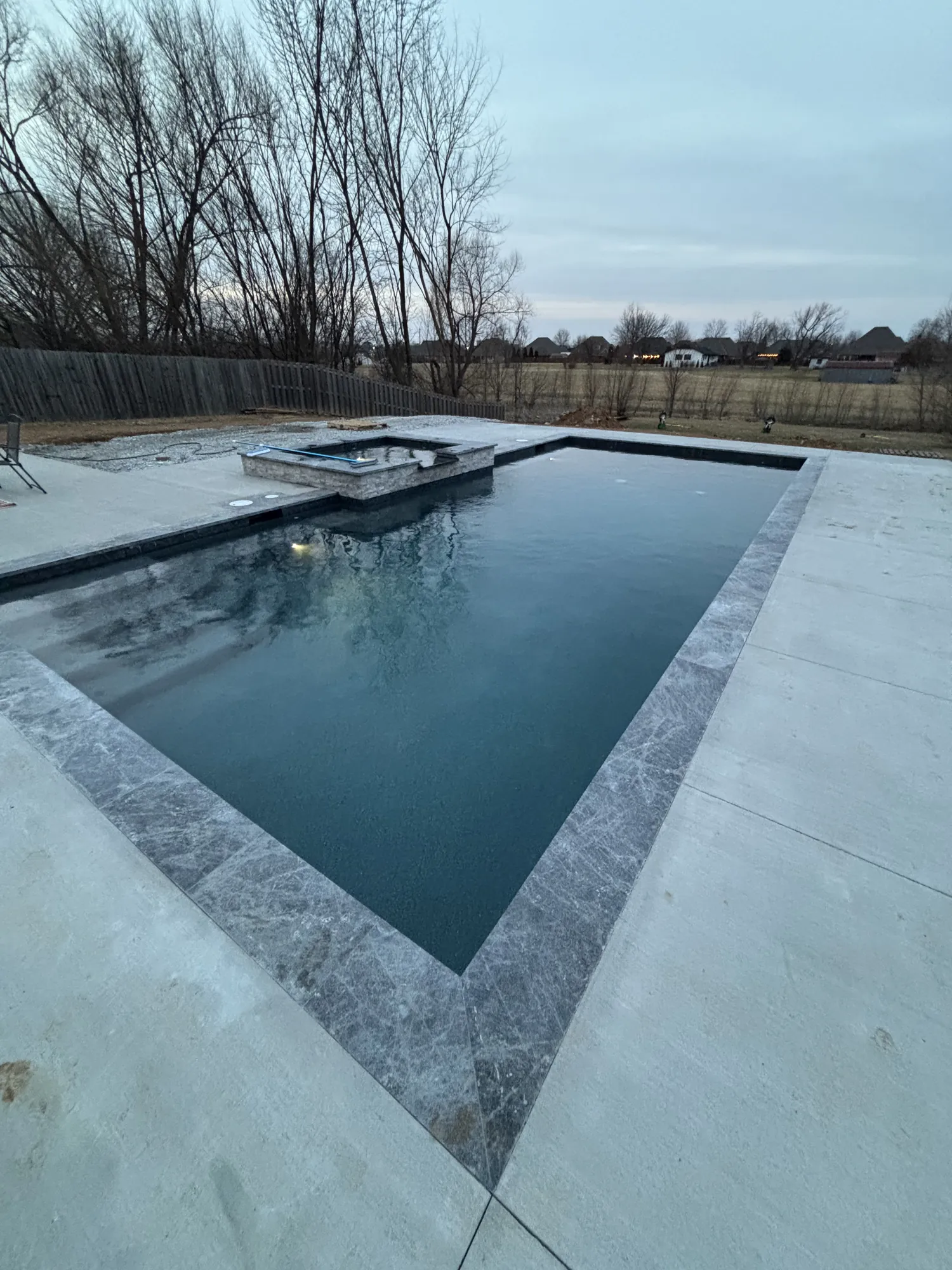 Rectangular pool with raised spa in Northwest Arkansas
